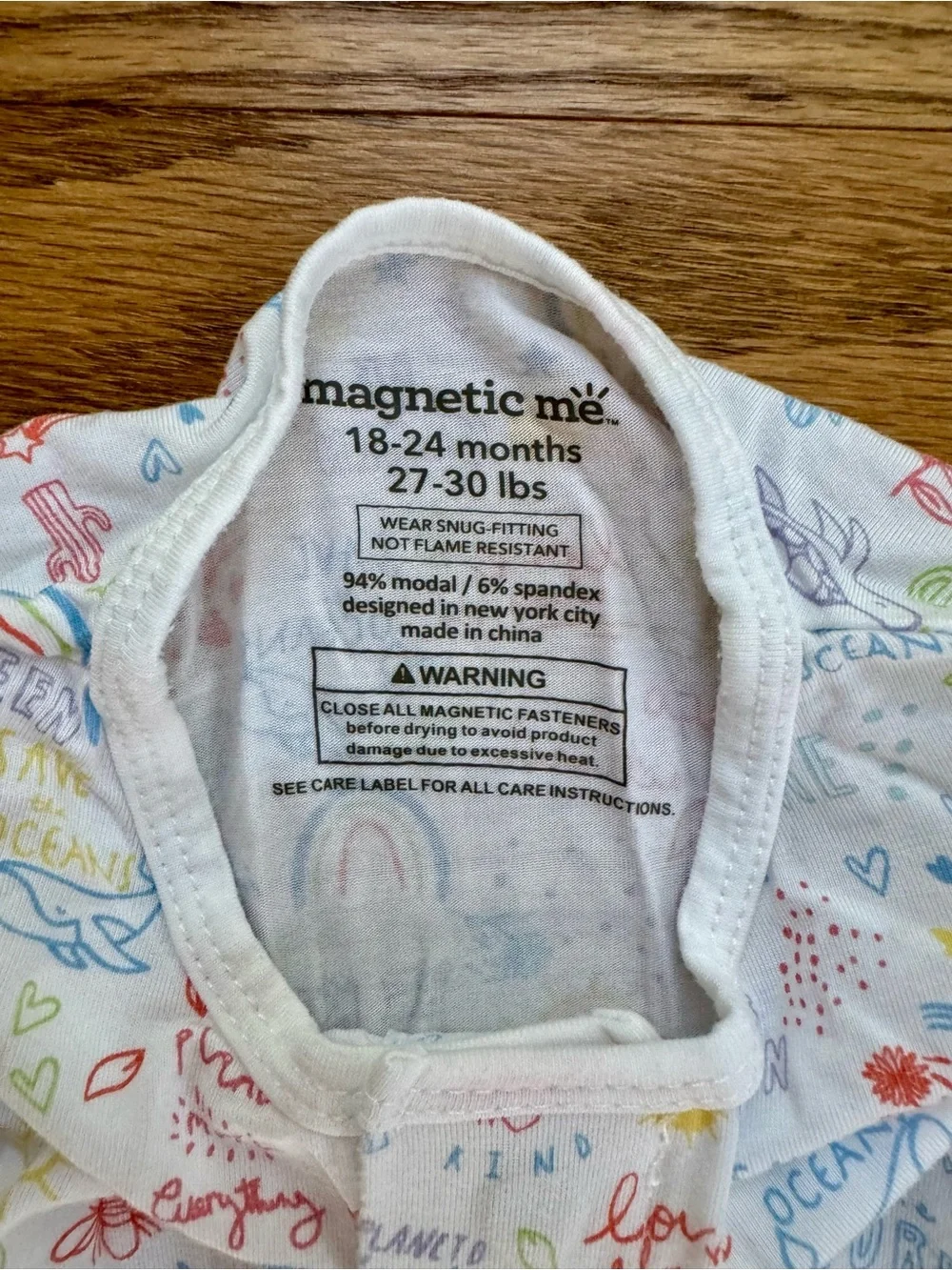 Magnetic Me White Footed One-Piece with Pastel Rainbow Print